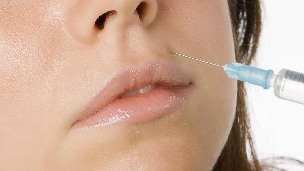 脸上黑痣上的毛可以拔掉吗